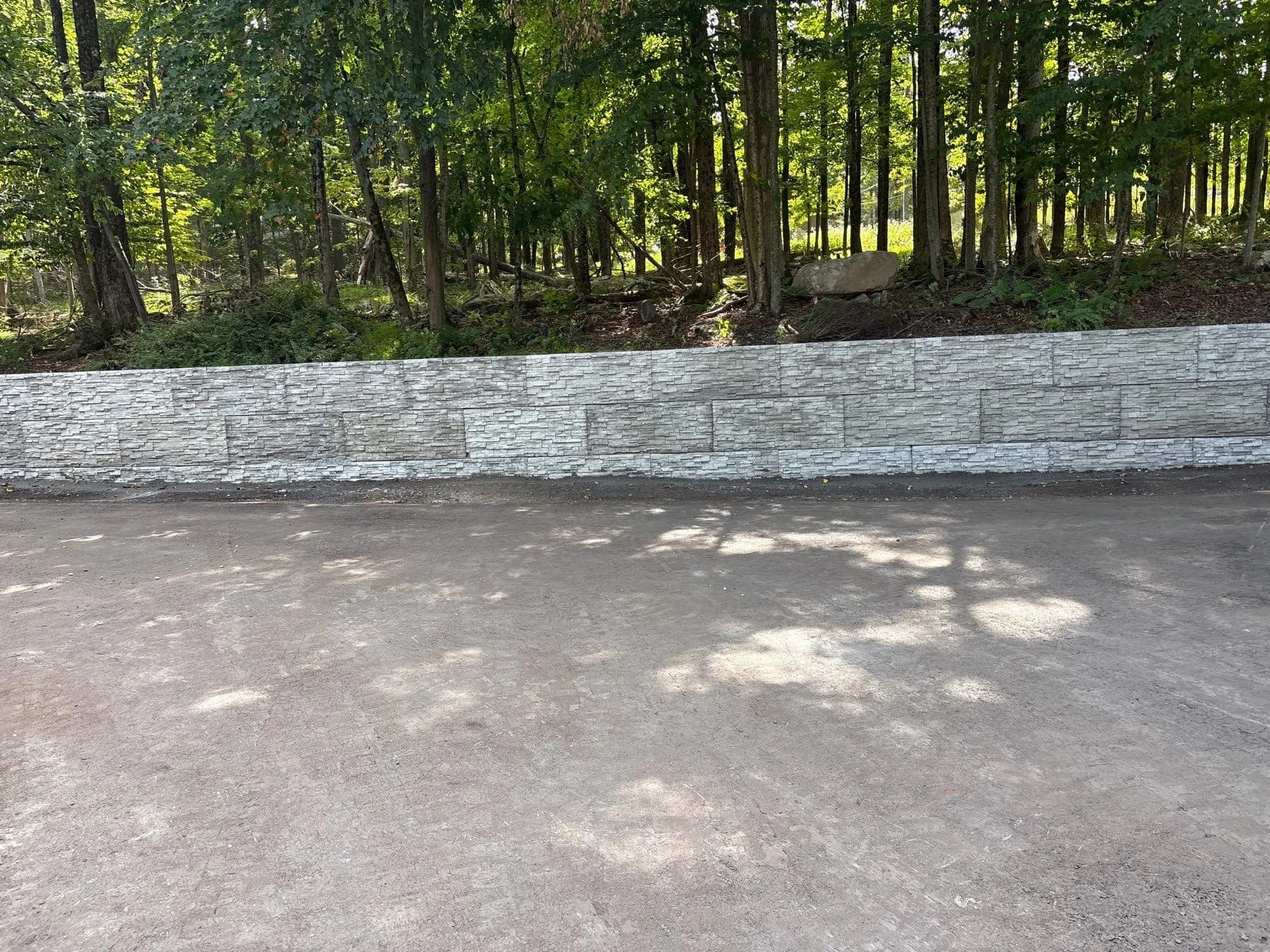 Gallery photos for Precast Ledge-Stone Retaining Wall Built for Strength and Curb Appeal: Image #1
