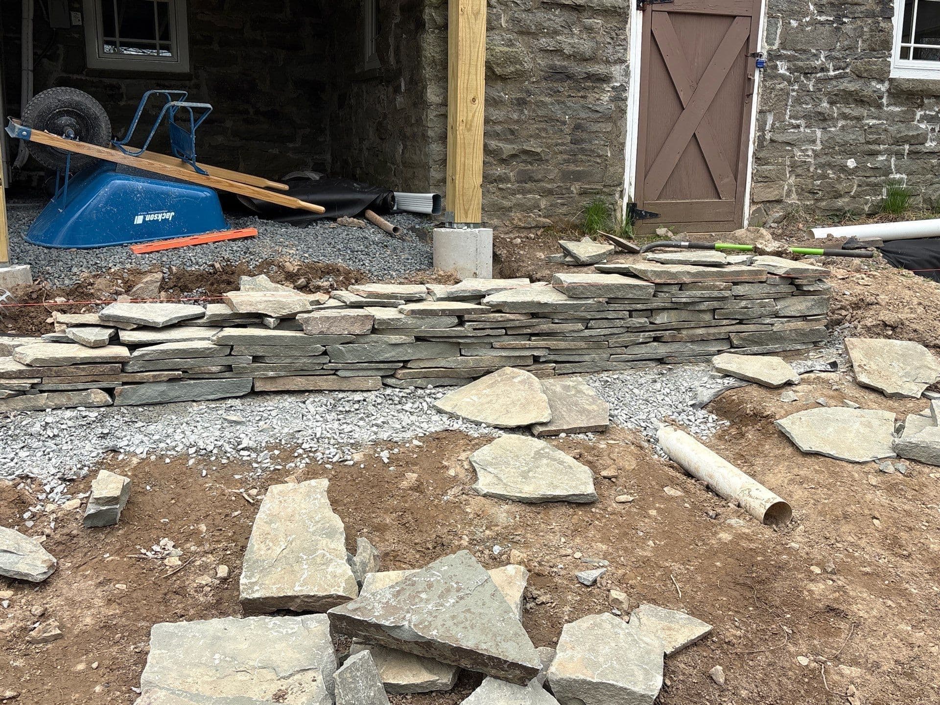 Gallery photos for Dry Stacked Stone Wall Taking Shape Piece by Piece: Image #1