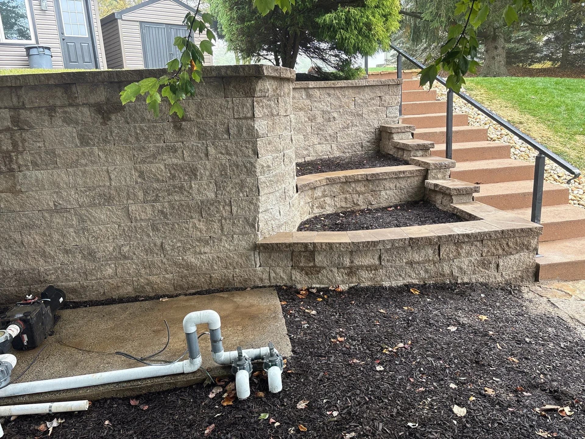 Block Wall Replacement with Tiered Beds and Fresh Mulch image